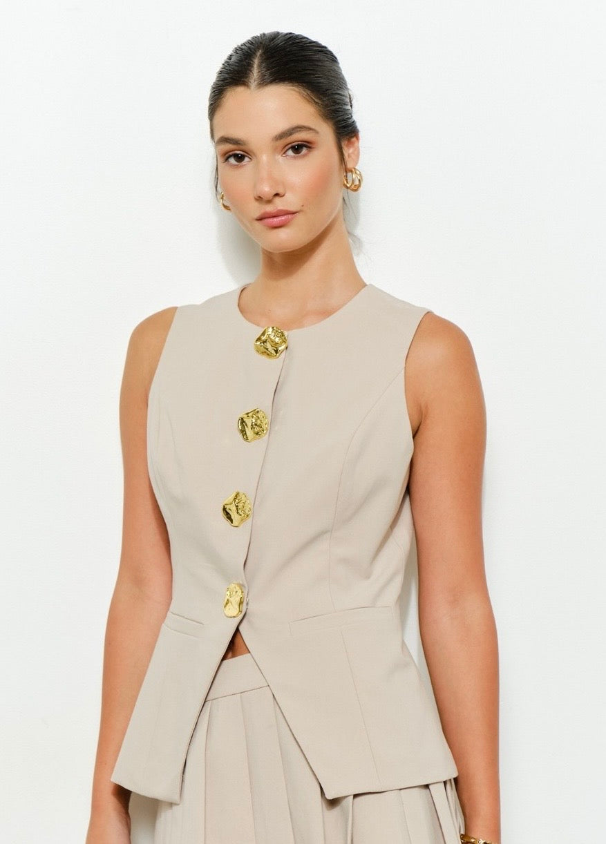 Blusa elegante con botones dorados