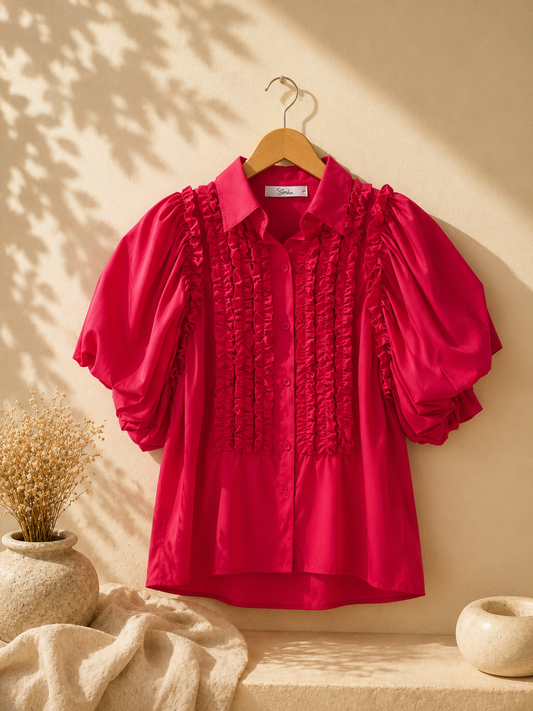 CAMISA CON LINEAS REGOCIGAS Y MANGAS BONBACHAS FUCSIA