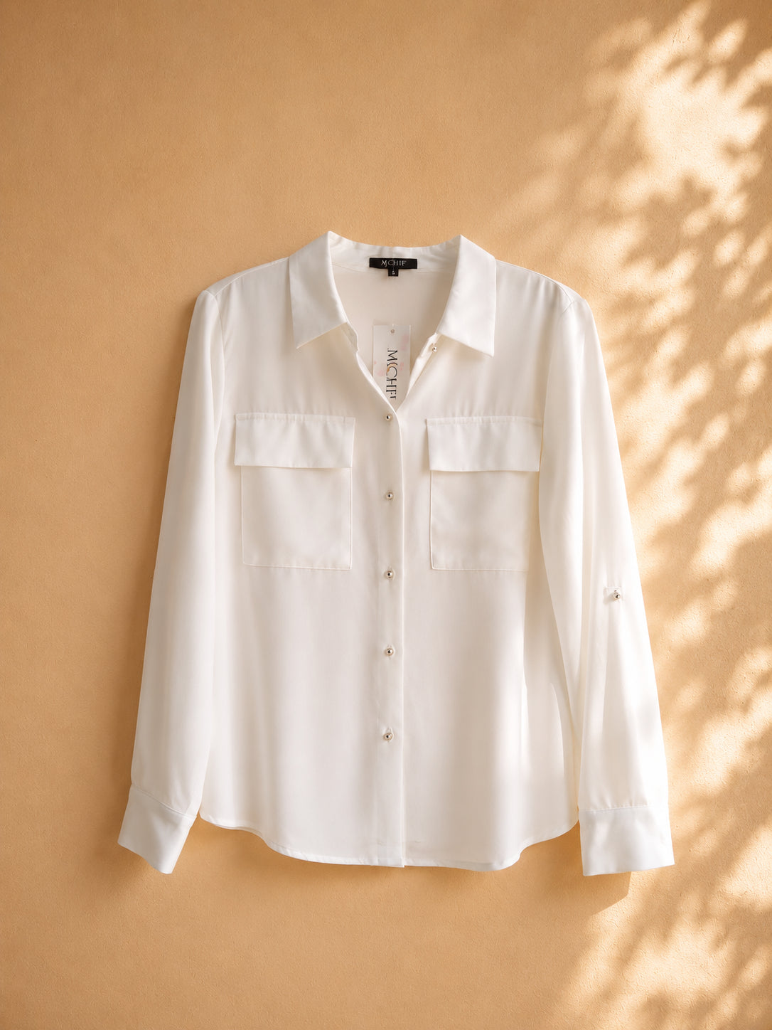 CAMISA BLANCA MANGA LARGA DE BOTONES PLATEADOS