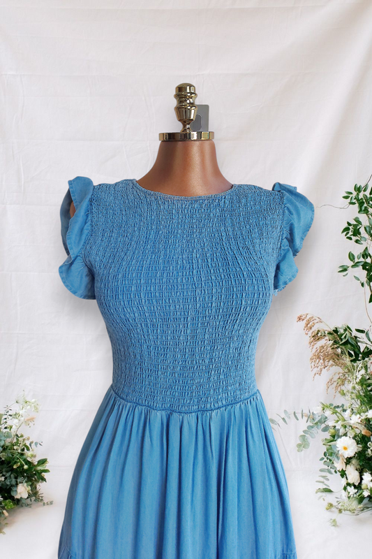 VESTIDO ESTILO JEANS DE ELASTICO LA PARTE DE ARRIBA