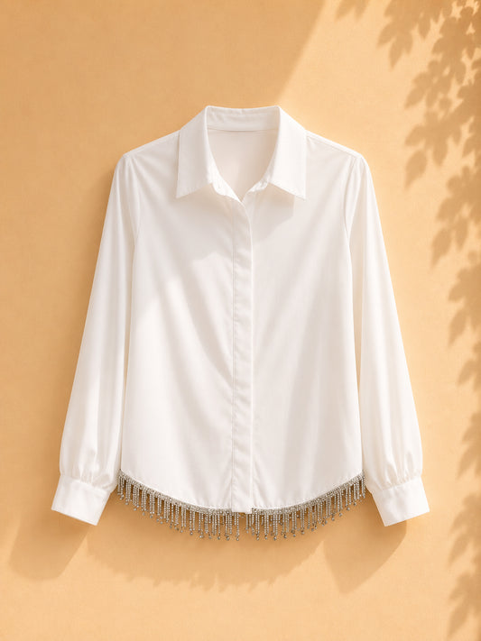 CAMISA MANGA LARGA BLANCA CON REVUELO DE ACCESORIOS PLATEADOS