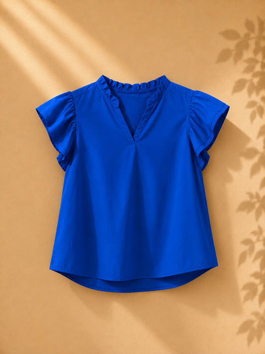 CAMISA AZUL CON MANGAS DE REVUELO CORTAS